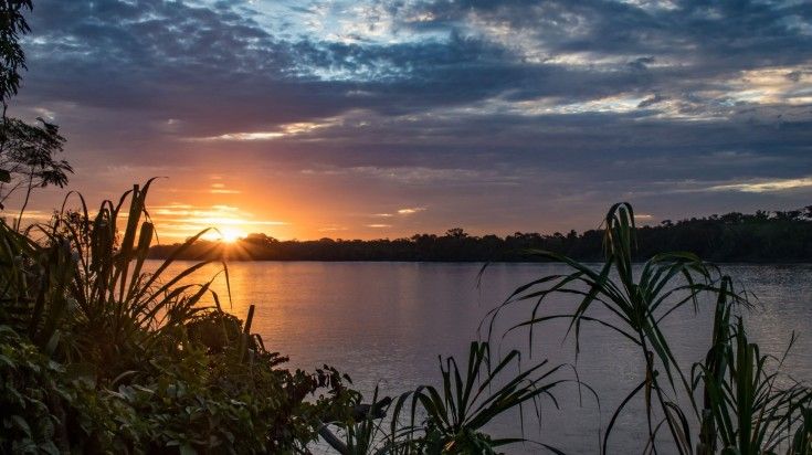 Sunset over the Tambopata River in Puerto Maldonado. Sunset over the Tambopata River in Puerto Maldonado.