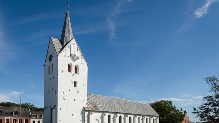 The front view of white cathedral of Thisted on a clear day in Denmark