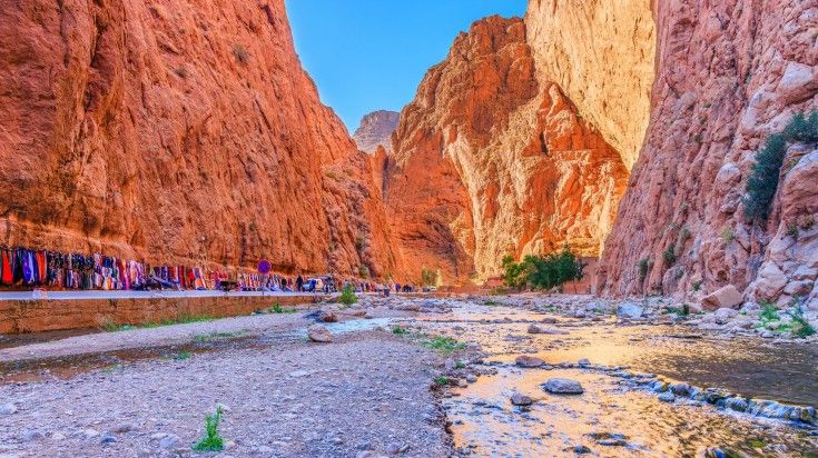 The view of Todgha Gorge by the Todra River on a clear day in Morocco.