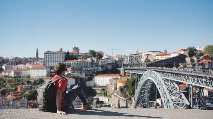 Tourist relaxing in Porto, a very good place to visit in November.