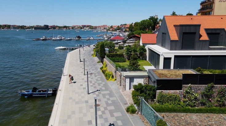 Tourist woman exploring the Mikolajki townscape