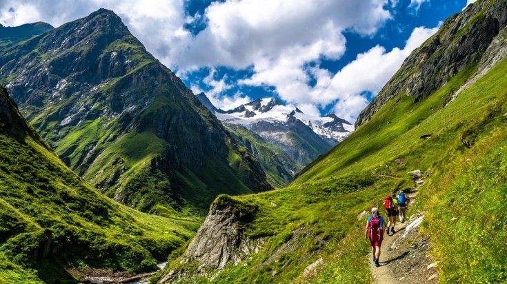 Tourists hiking the Hohe Tauern National Park in summer.