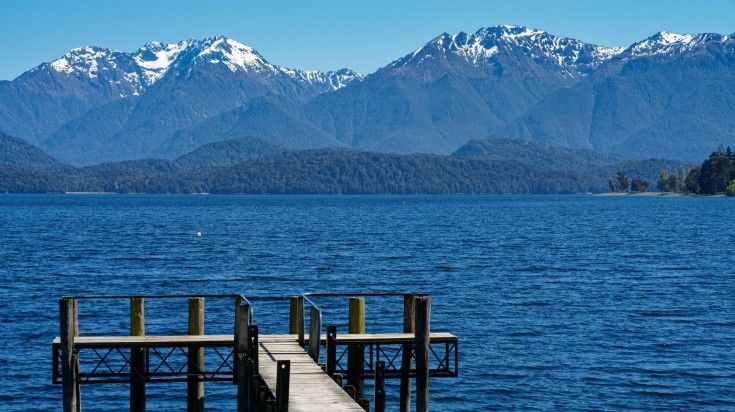 View over a jetty on Lake Te Anau waterfront. View over a jetty on Lake Te Anau waterfront.