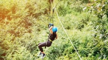 Woman ziplining in the Arenal.
