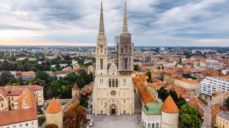 Marvel at the stunning Gothic architecture as you explore Zagreb Cathedral, a symbol of the city's rich history and cultural heritage. The view of old Zagreb Cathedral on a cloudy evening in Croatia.