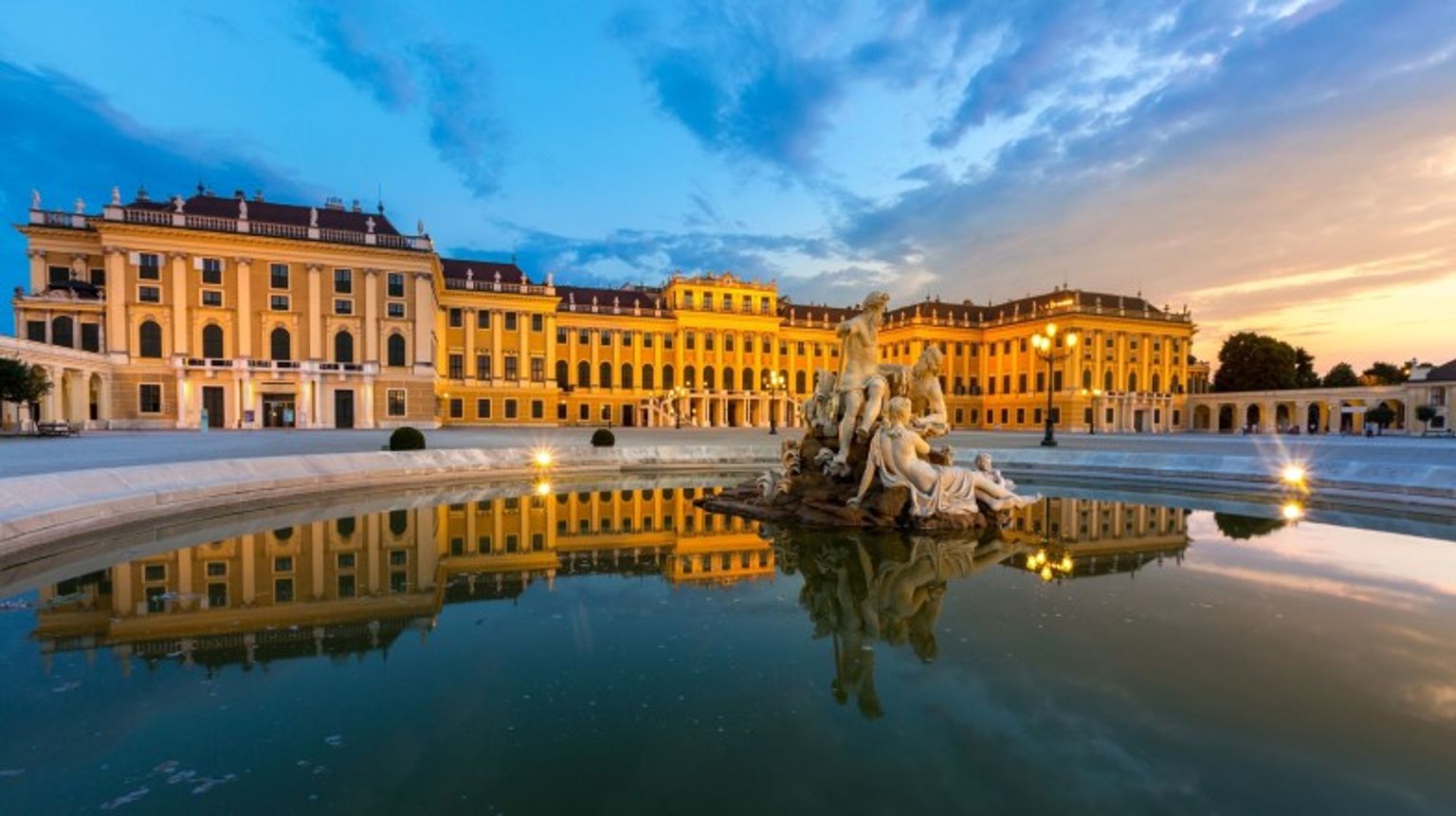 See Schonbrunn Palace during sunset while spending 10 days in Austria.