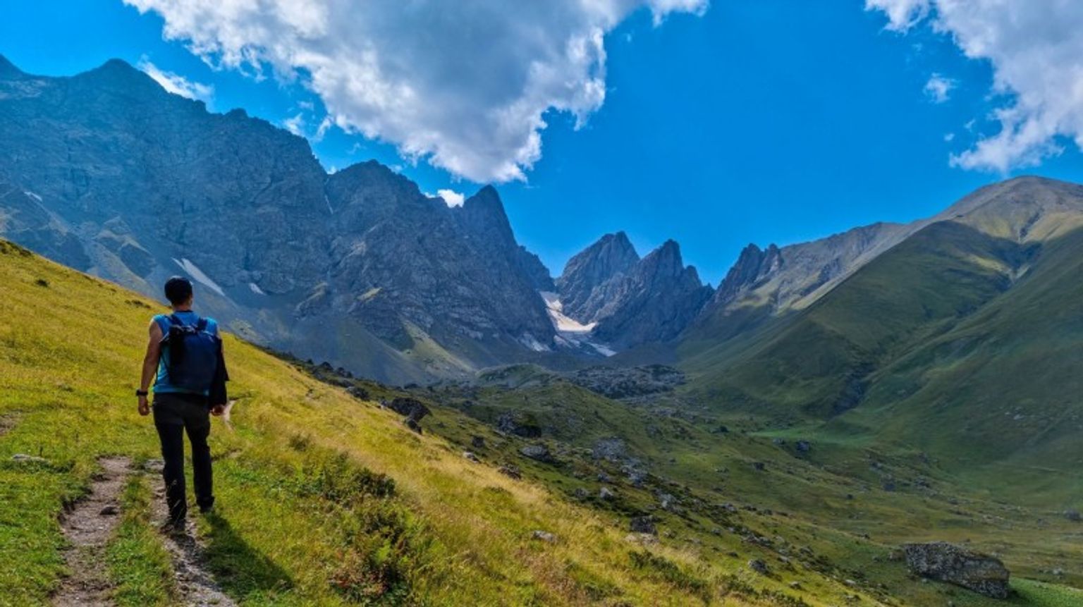 A hiker in Caucasus Mountains on a clear day during his 10 days in Georgia.