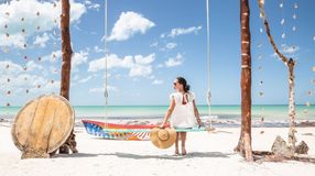 A girl sitting and enjoying the beach during her 10 days in Mexico.