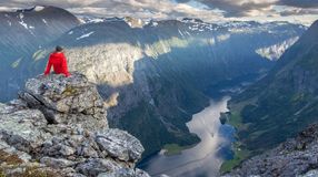 A man resting above Naeroyfjord and enjoying the view during his 10 days in Norway.