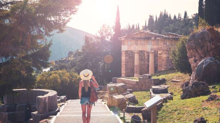 A tourist walking during sunset in Delphi during her 11 days in Greece.