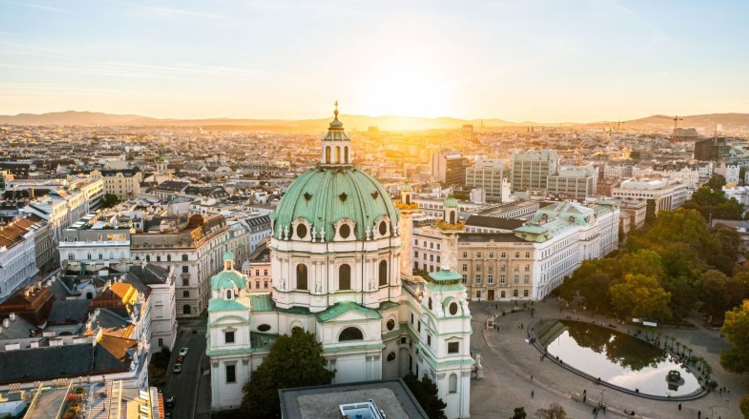 See St. Charles Church during sunset while spending 4 days in Austria.
