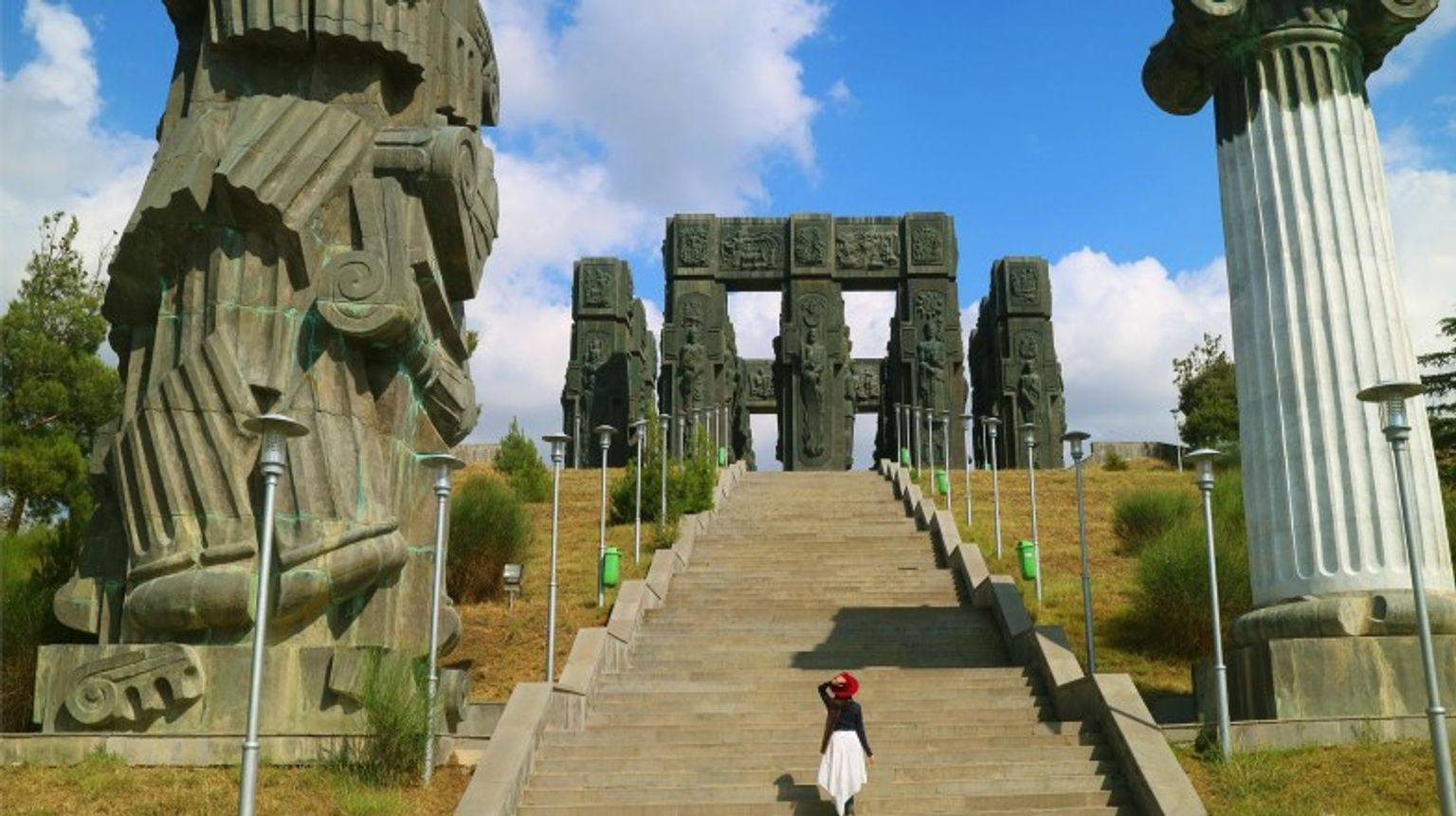 A girl admiring the beauty of Chronicle of Georgia during your 4 days in Georgia tour.