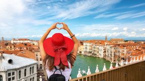 A female tourist posing over the skyline in Venice during her 4 days in Italy trip.