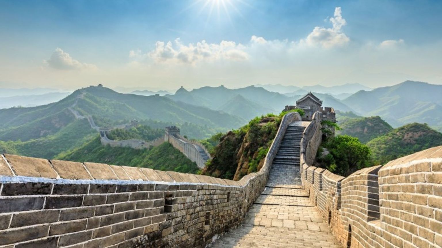 No trip to China is complete without visiting the Great Wall—make it a highlight of your 12 days in China. The view of the Great Wall of China on a sunny day during your 12 days in China.