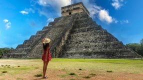 A girl admiring the beauty of the pyramid of Chichen Itza during her 5 days in Mexico.