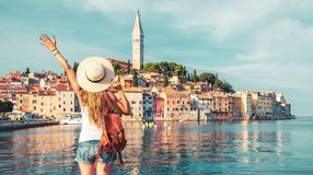 A girl with open arms Rovinj City, one of the best places to visit in Croatia.