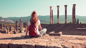 A woman in the Volubilis site in Meknes; best time to visit Morocco.