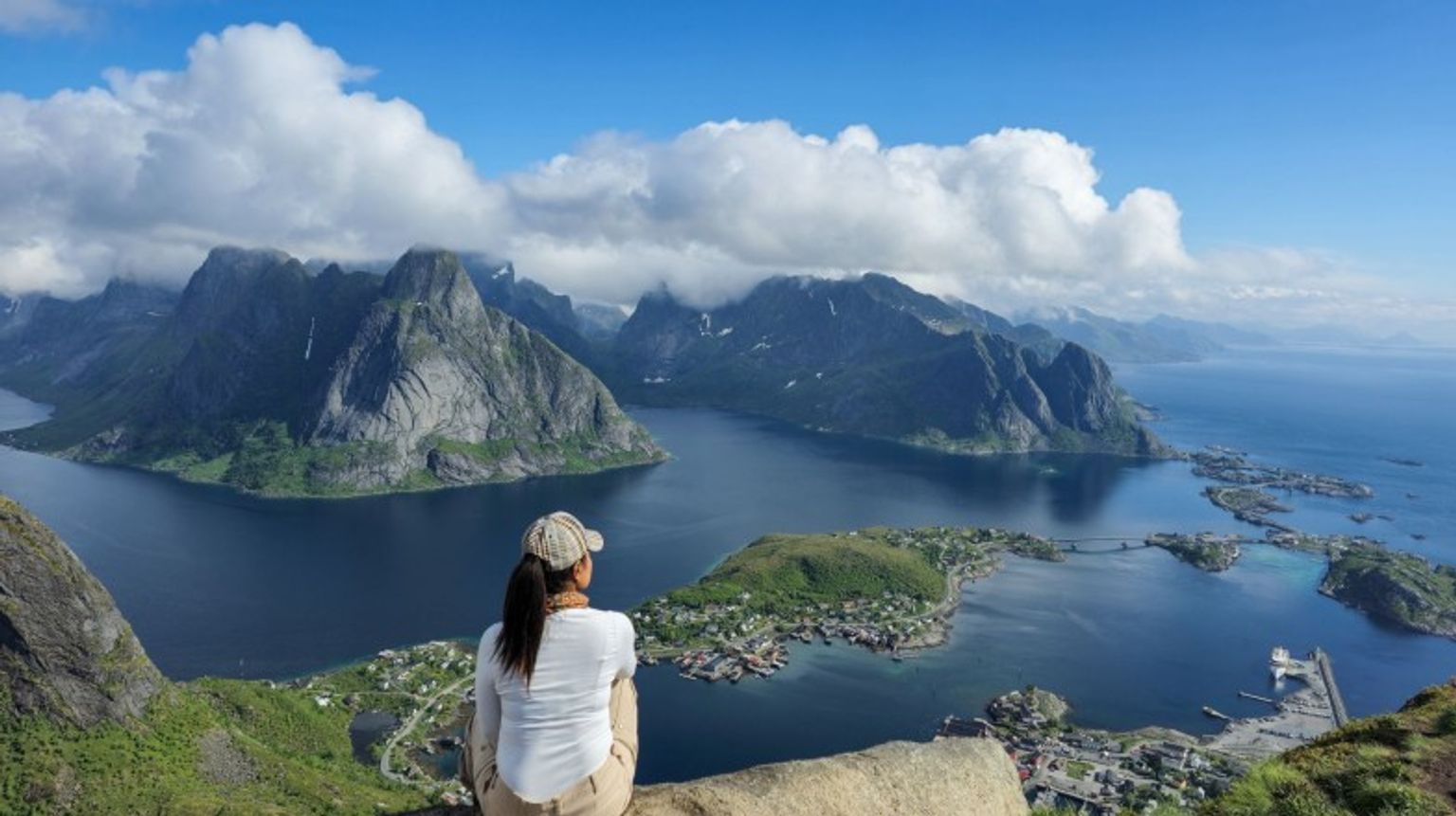 A girl in Lofoten Island enjoying the view on a cloudy day during her 6 days in Norway.