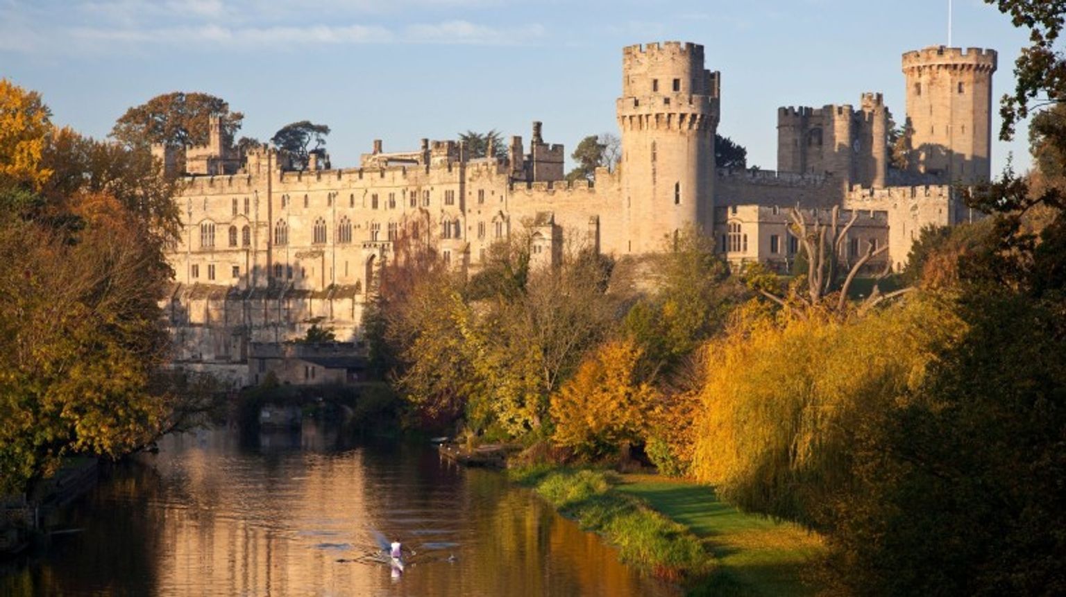 Man kayaks on the river that runs through Warwick Castle, England