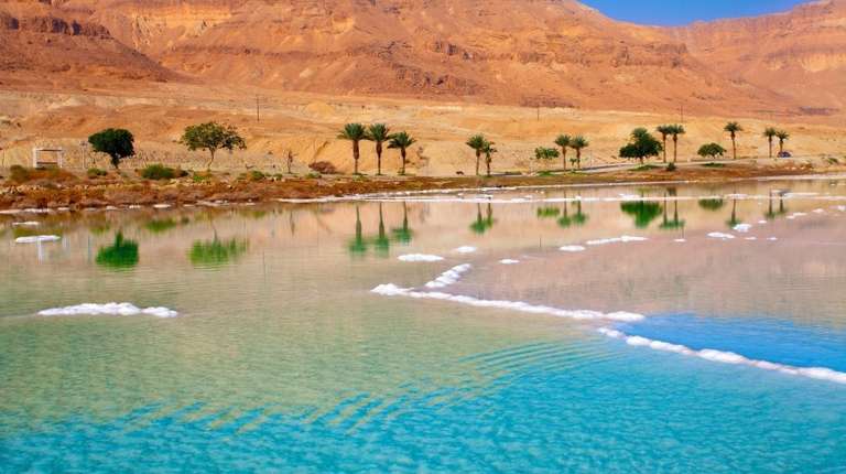 The sea shores of the Dead Sea on a clear day in Jordan in June.