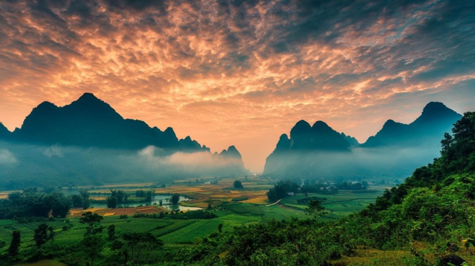 Watch the sunrise at Phong Nam Valley while spending 21 days in Vietnam.