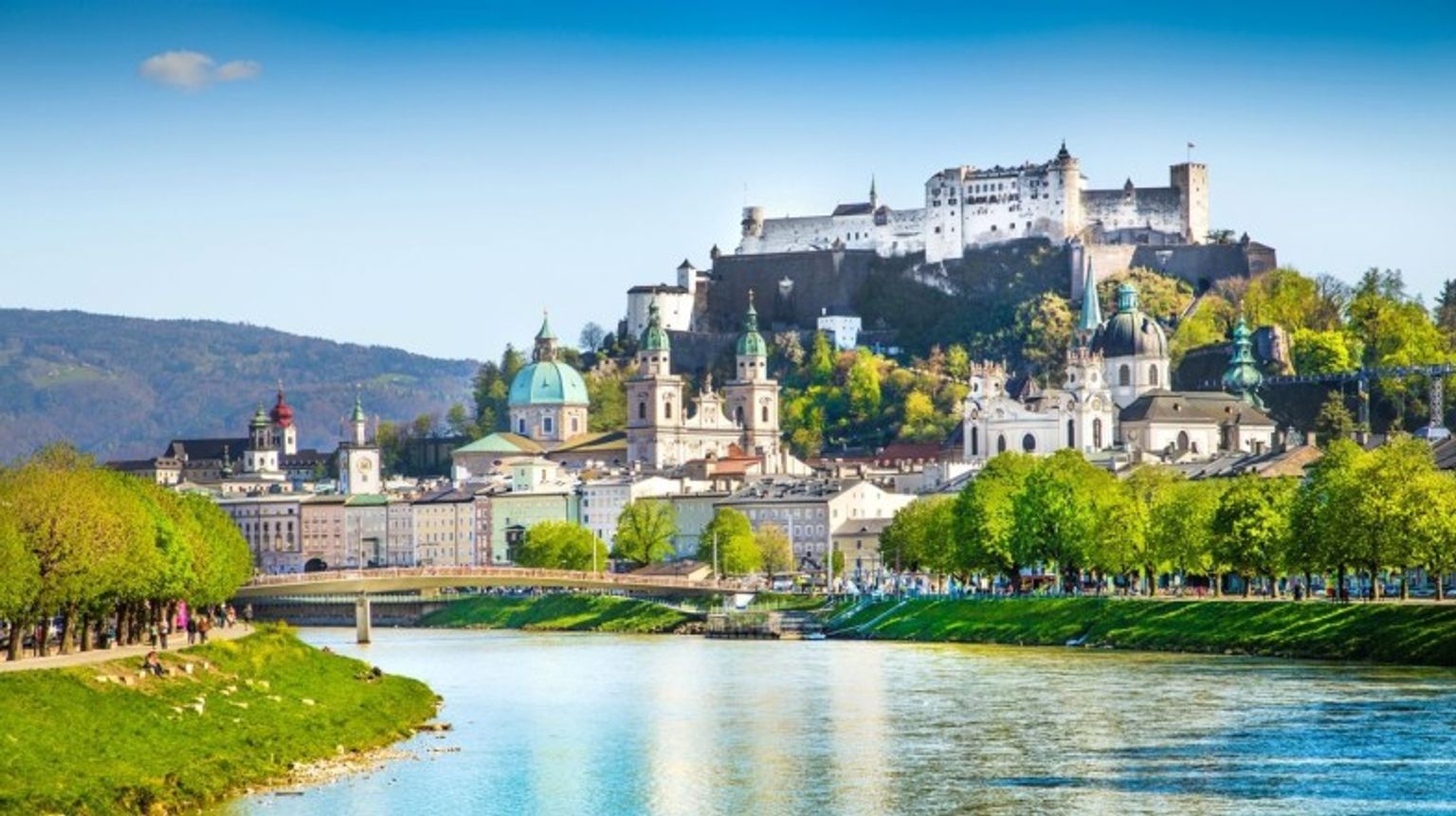 Historic town of Salzburg with Salzach river during August in Austria