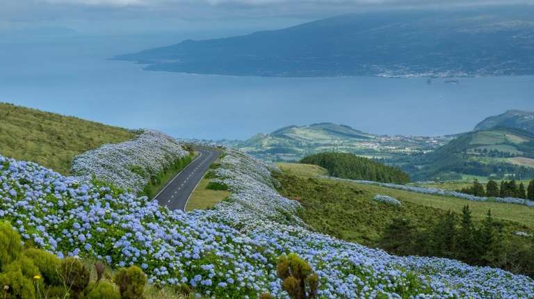 Blue hydrangeas flock the fences in Flores, while the lakes of Sete Cidades see more clear and sunny days in the Azores in April.