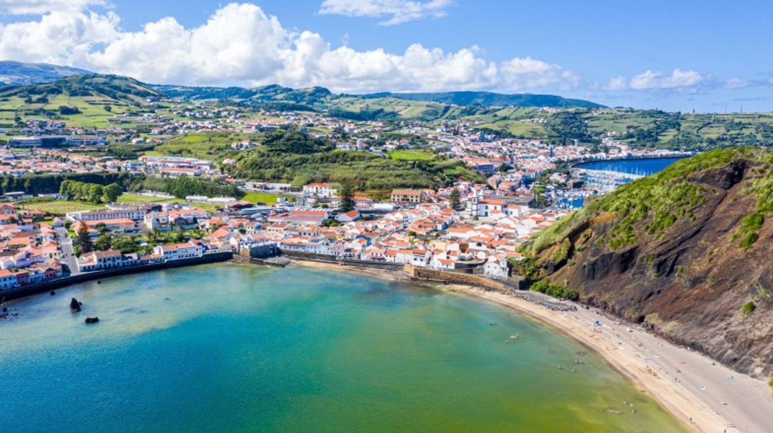 A beach-side town in the Azores teeming with people during July