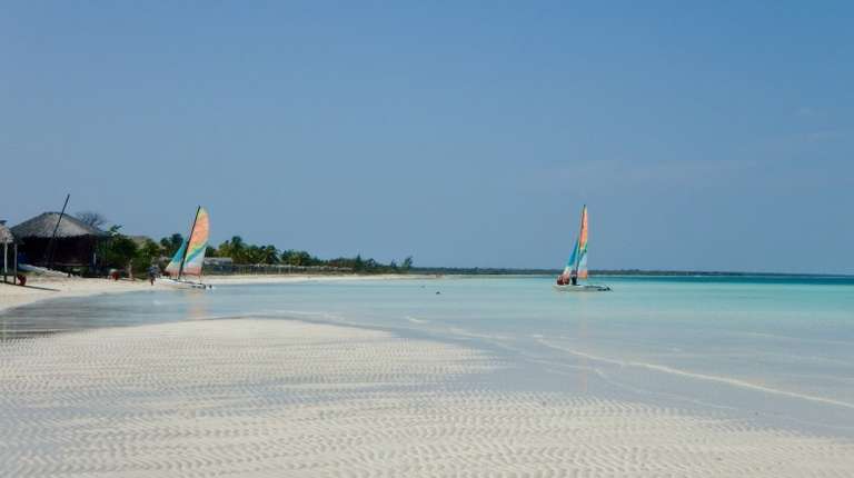 Boats in the shallow waters of Cayo Coco during summer in Cuba.