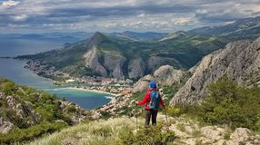 A woman hiking on the Adriatic coast, which is one of the top things to do in Croatia.