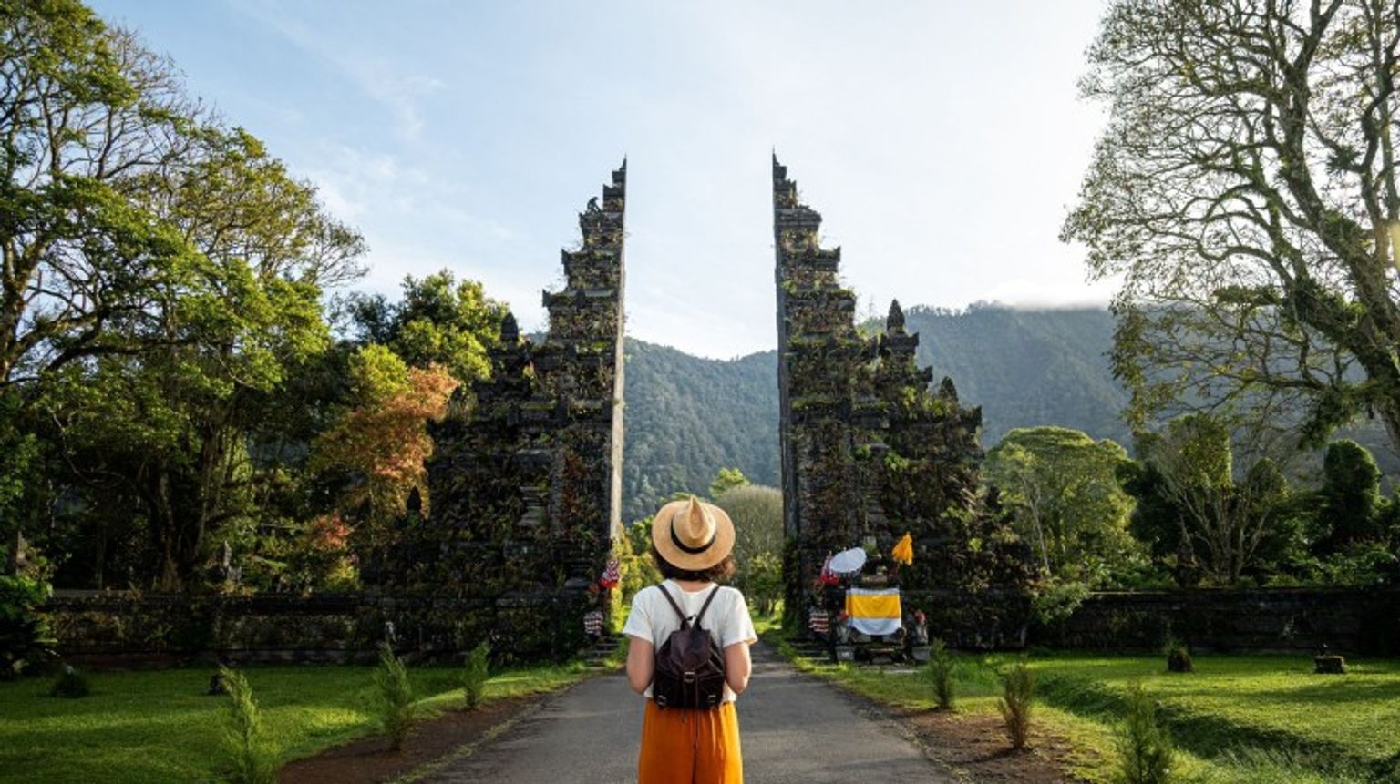 A woman admiring the beauty in Hindu temple during her 8 days in Indonesia trip.