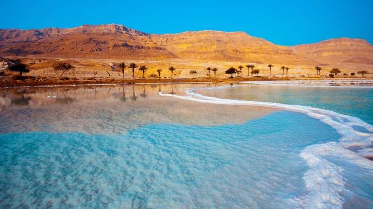 The Dead Sea is a salt lake bordered by Jordan and Israel; best time to visit Jordan and Israel.