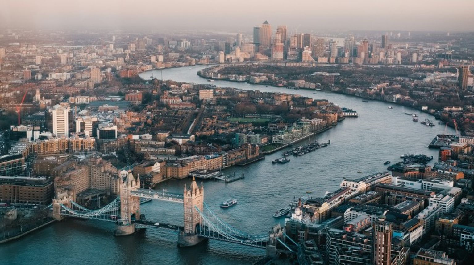 You cannot arrive to England and miss out on all the iconic sites London has to offer. London cityscape view with the Thames River and London Bridge