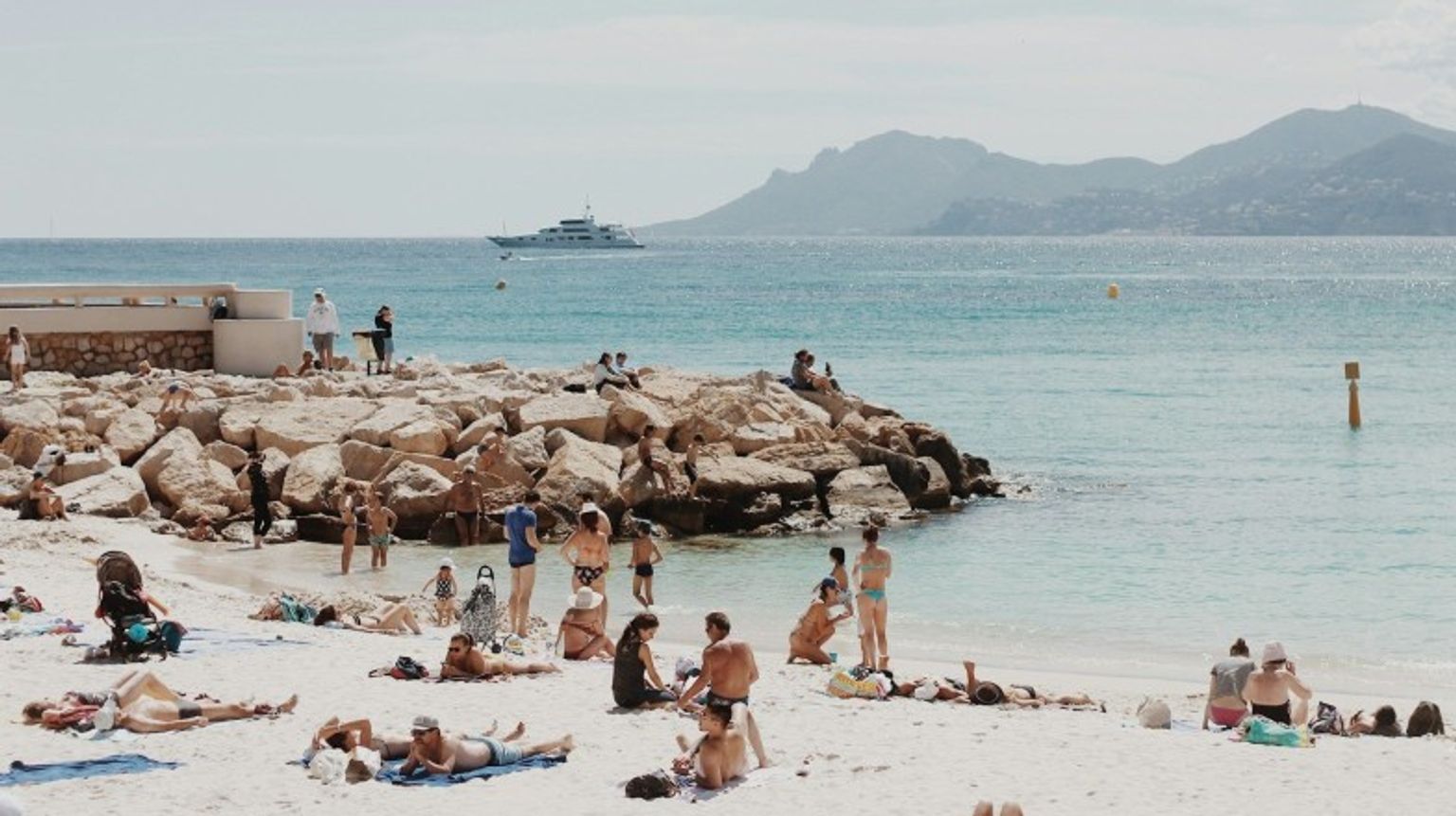 Beach in Cote d Azur filled with people on a vacation in France