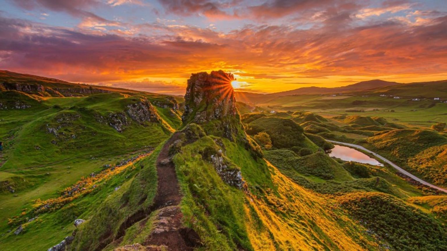 Take in this sunset on Skye during your 12 days in Scotland.