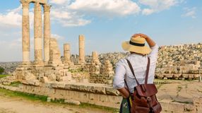 A woman tourist in front of Temple of Hercules on a clear day in Jordan in January.
