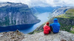 A couple admiring the view of Trolltunga during their one week in Norway.