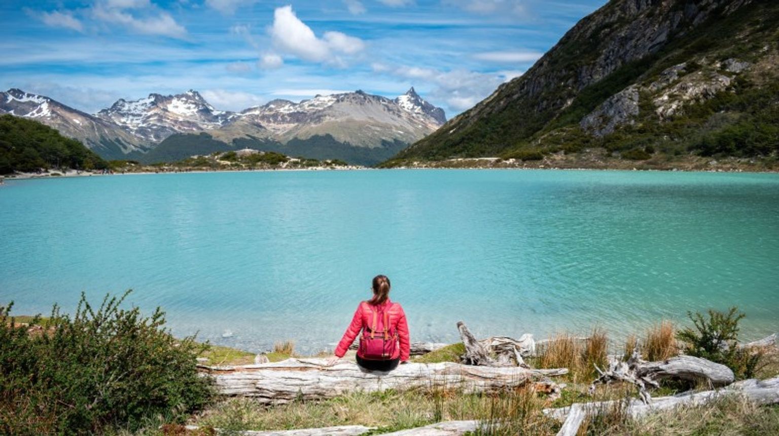 A young tourist enjoying the scenic view in Ushuaia during her one week in Patagonia.
