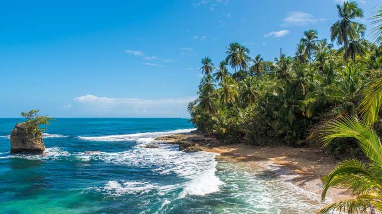 Paradise beach with blue sky during summer in Costa Rica.