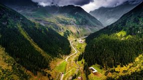 The Transfagarasan Highway running through the lush Carpathain mountains can be done during 14 days in Romania