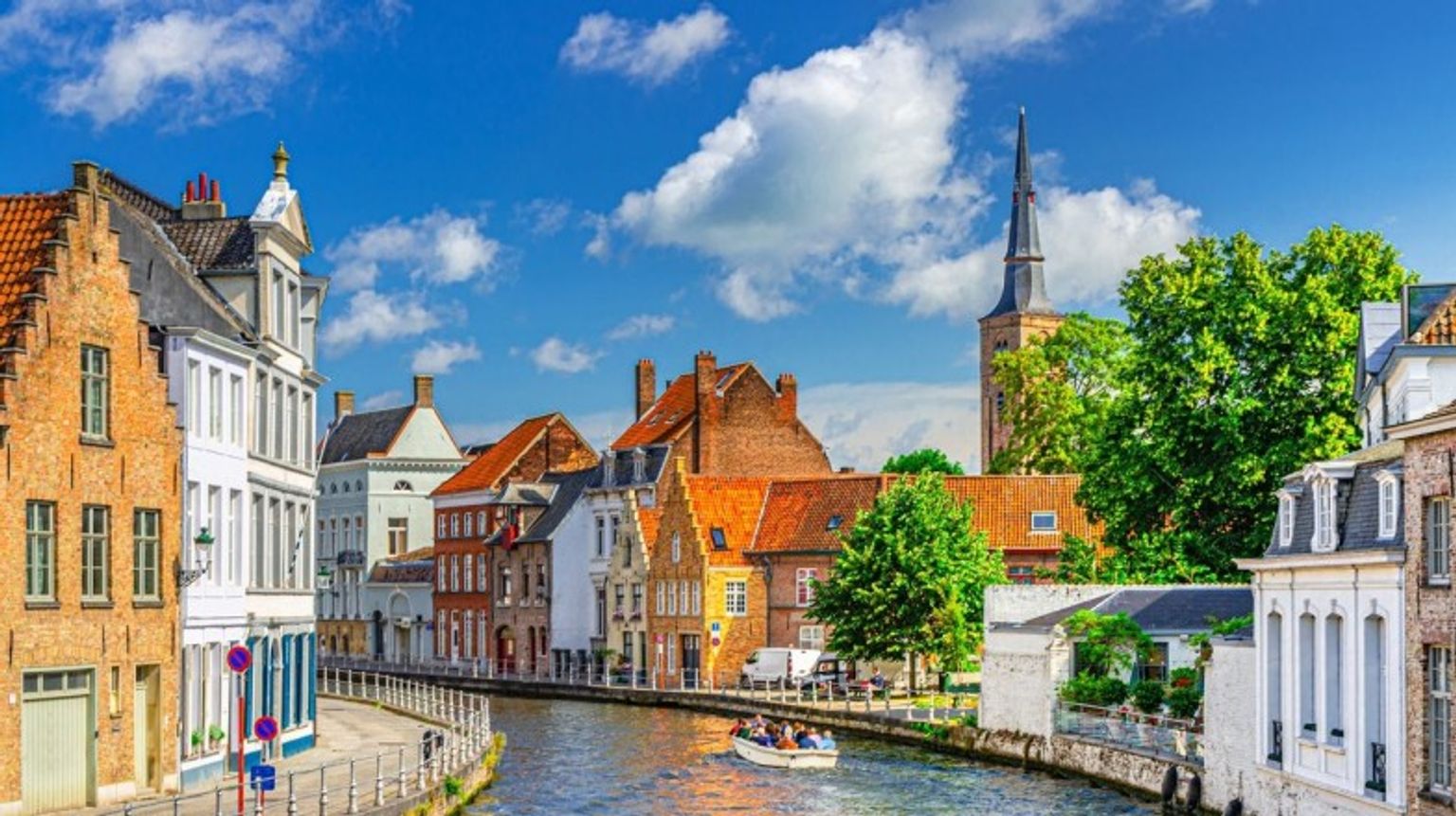 Tourists boating in Sint Annarei water canal during their 5 days in Belgium.