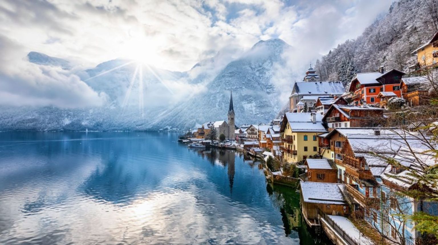 Visiting Austria in January, you must take to the mighty Alps region for a mystical experience. Village in the Alps; the best place to be on your trip to Austria in January.
