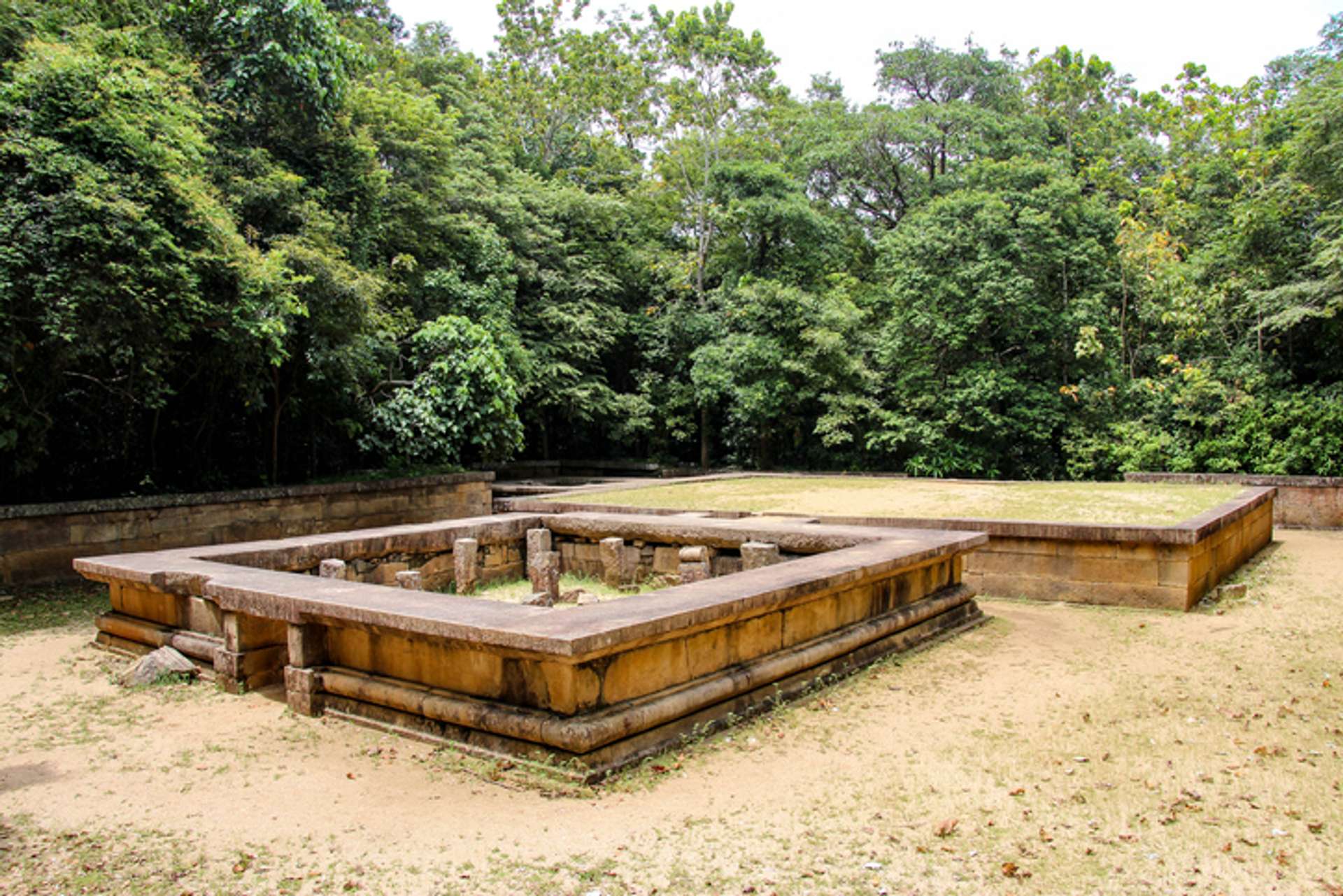 The ruins of an ancient monastery in Ritigala surrounded by green trees