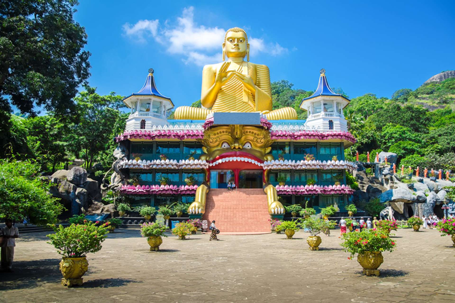 A big golden Buddha statue at a monastery in Sri Lanka