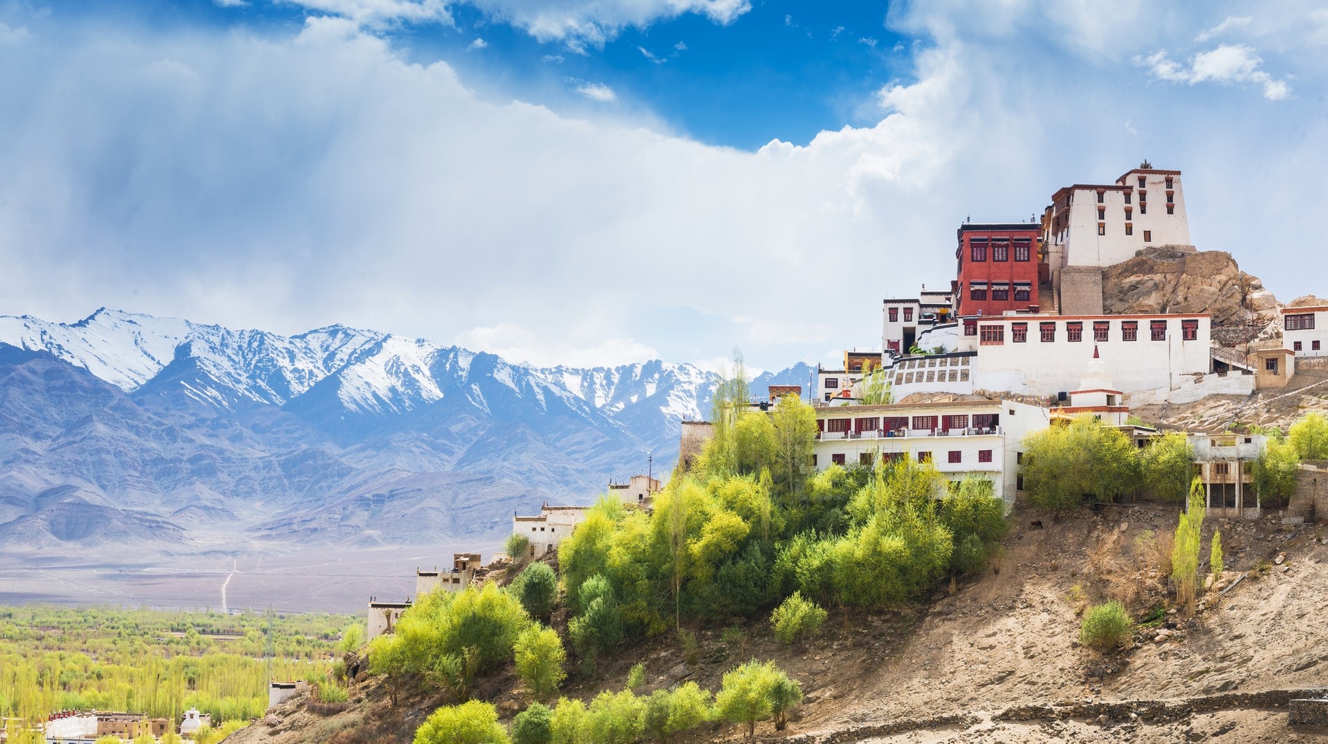 According to the 2011 census in India, Buddhists make up 0.7% of India's population (8.4 million individuals) View of white colored building on top of a hill