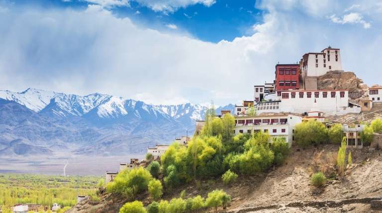View of white colored building on top of a hill
