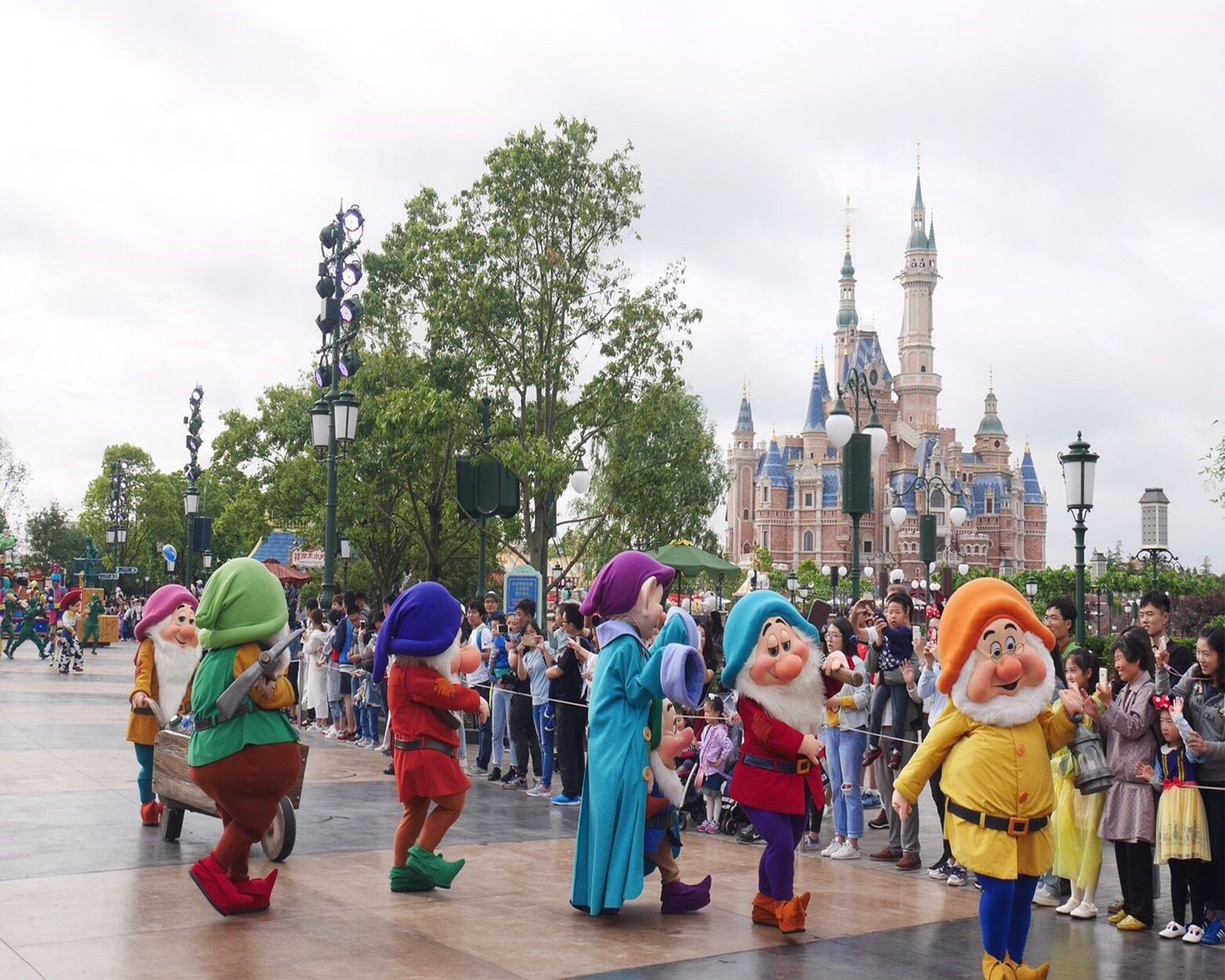 Visitors being entertained at Mickey Avenue &mdash; the entrance of Disneyland