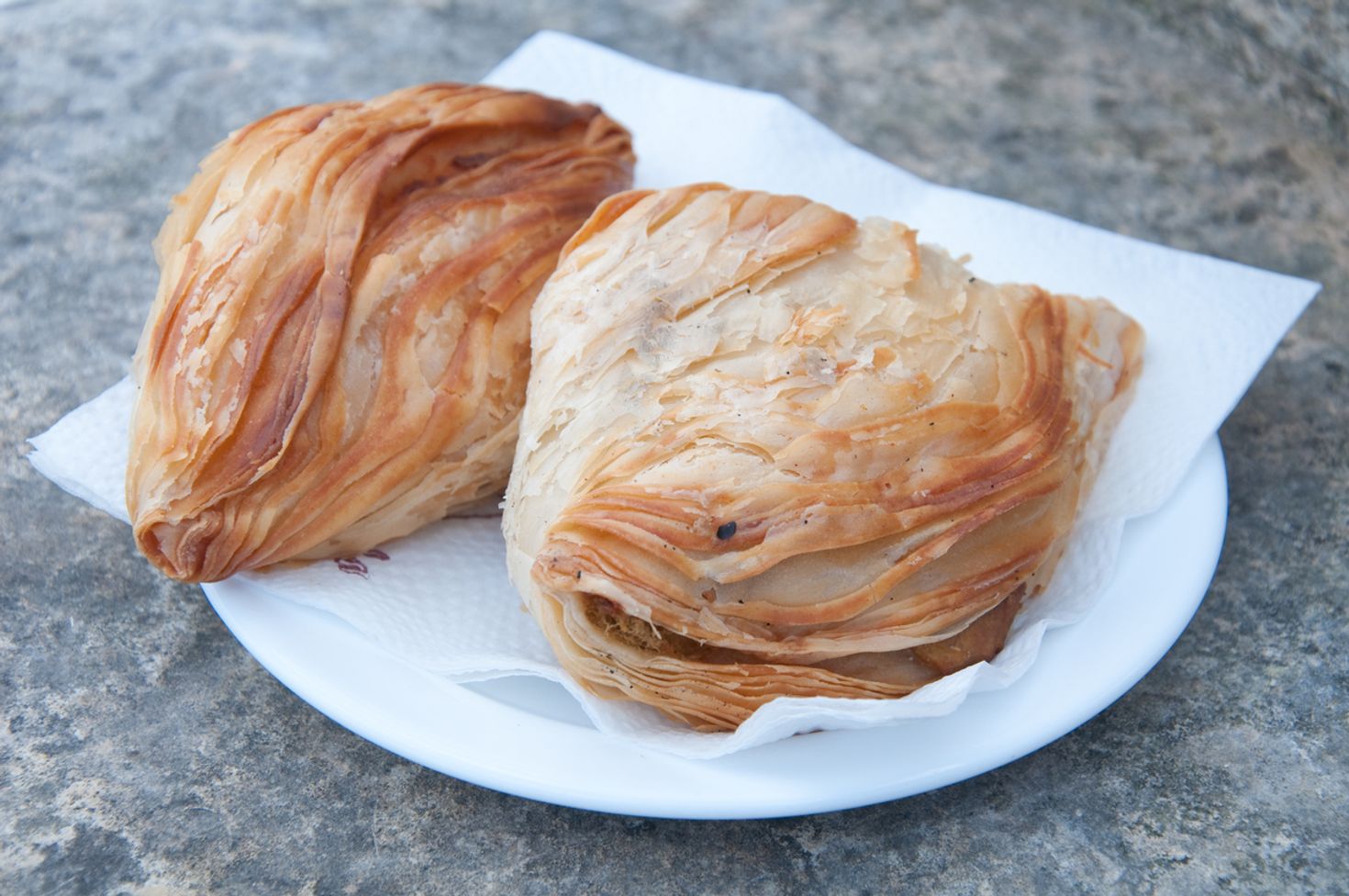 Two Pastizzi served on a plate. 