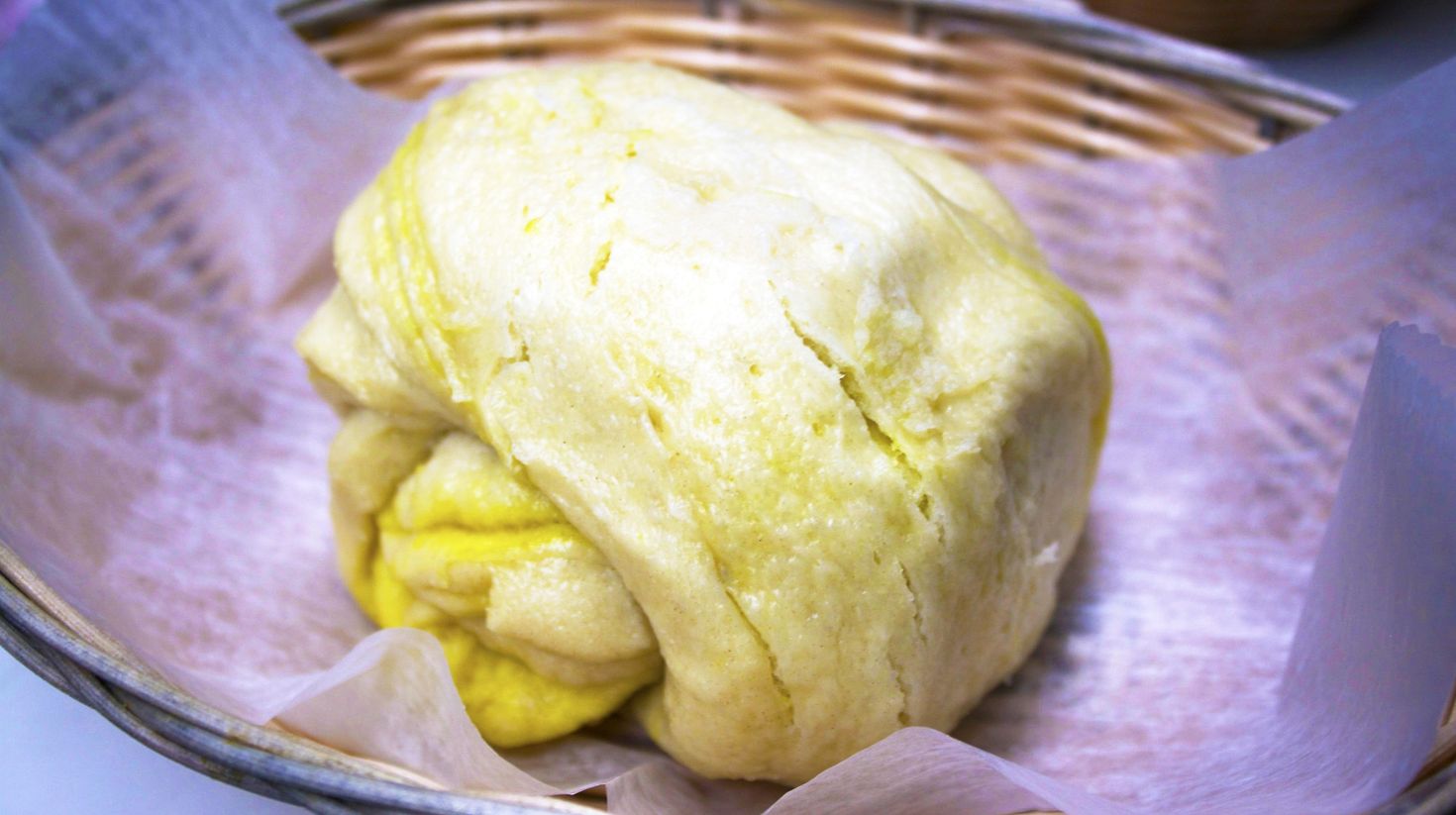Rolled and cooked dough placed a wooden basket