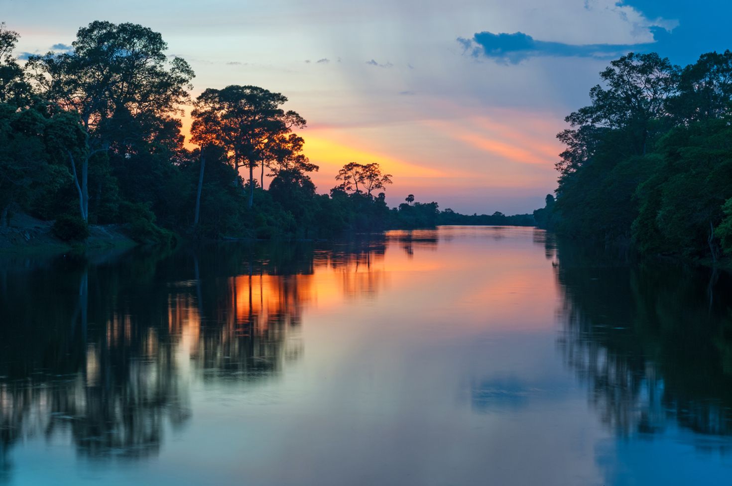 Sunset at a river boat tour in Manu National Park in Peru